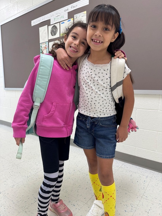 Two students wearing wacky socks