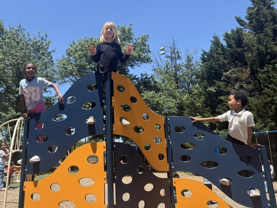 Children playing in the playground on a sunny day