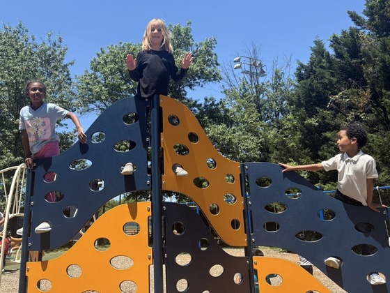 Children playing on the playground on a sunny day