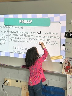 Student Writing on the Board