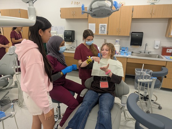 Dental students care for patients