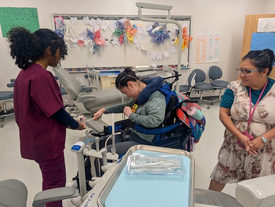Dental students work with disabled students