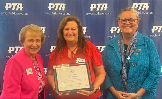 Mrs. Bowman (center) received a Shining Star Award from a representative of the FCCPTA (left). Dr. Reid is standing on the right in the photo.