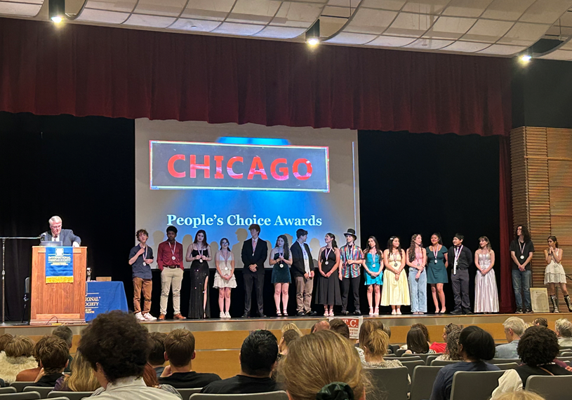 Students receiving awards on stage