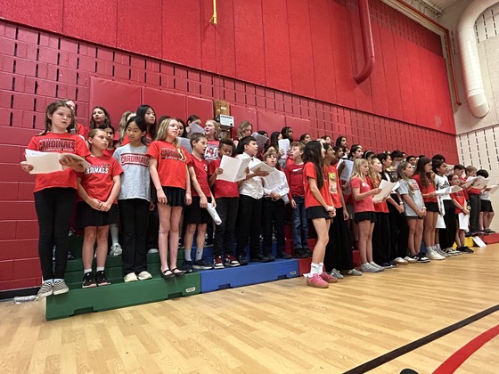 5th and 6th grade choir students perform at school assembly
