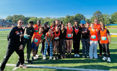 group of students in track uniforms