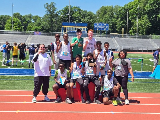 a photo of Mr. Marsh and Ms. Henry with Twain's Track and Field participants