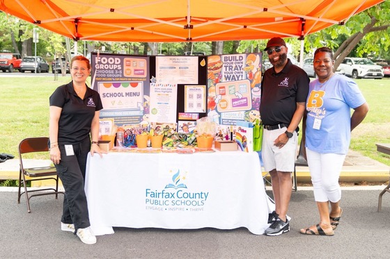 FCPS staff at their Summer Extravaganza booth