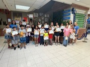 students holding certificates