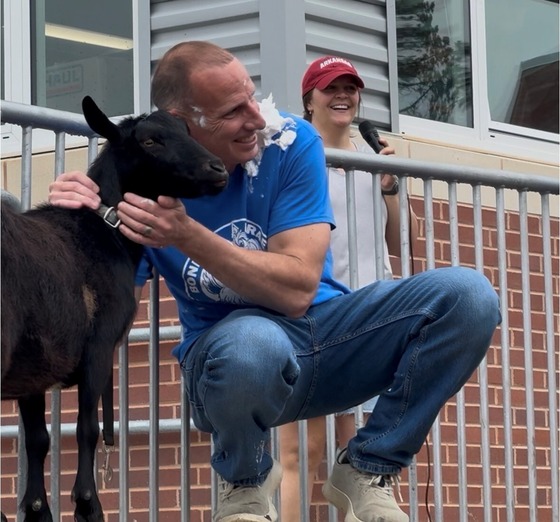 Mr. Birge petting the goat