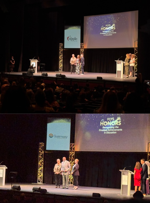 Staff accepting awards on stage