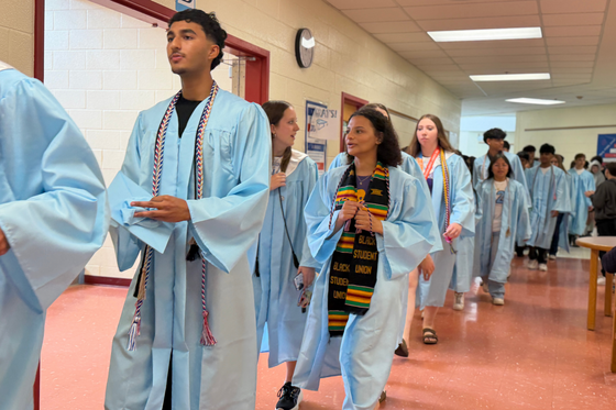 Centreville HS graduates walk the halls of Liberty in their graduation gowns