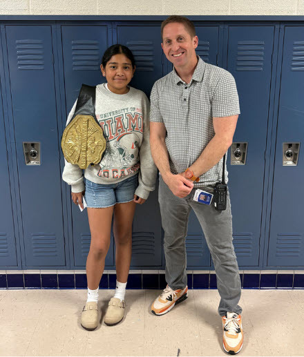 Dayana pictured with middle school SOSA, Mr. Bedard