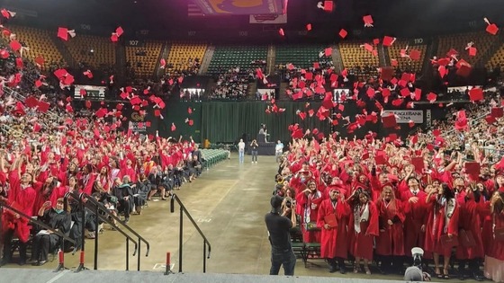 Herndon's graduation the moment the students tossed their caps in the air.