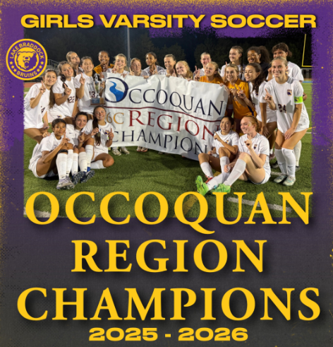 Girls soccer team standing and sitting together smiling while holding Occoquan Region Champions banner