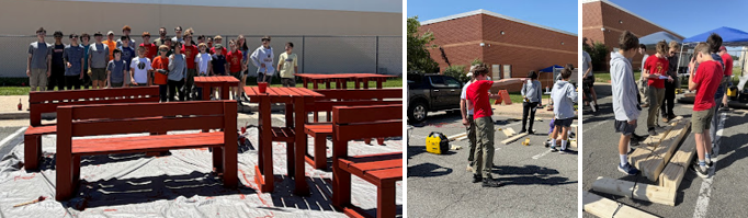 Scouts building tables and benches and standing together in a group afterward