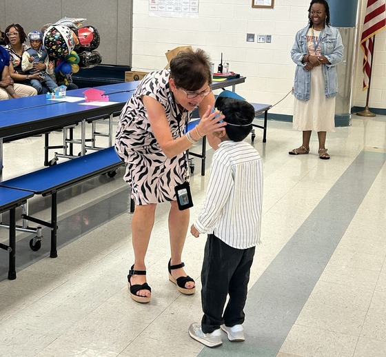Student getting their preschool promotion "cap"