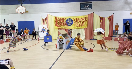 Students dressed as clowns performing in the Kindergarten Circus
