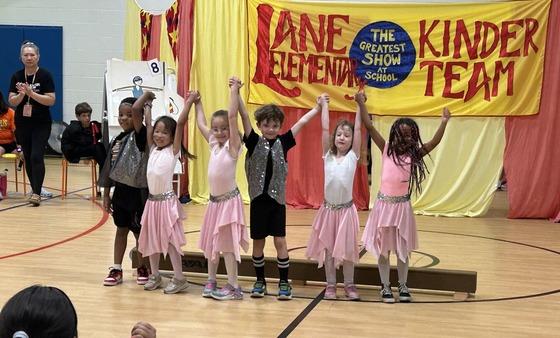 Students dressed as tightrope walkers performing in the Kindergarten Circus