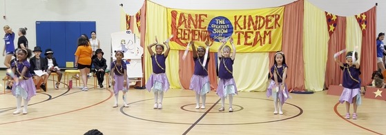 Students dancing with ribbons performing in the Kindergarten Circus