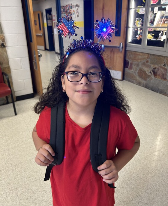 student with red, white and blue sparkly headband