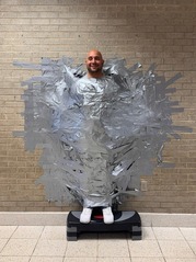 Mr. Marotta taped to a wall