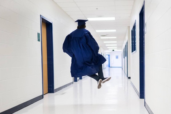 student jumping for joy