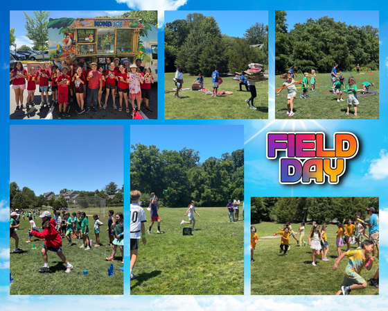 Elementary school students in matching t-shirts playing a tug-of-war game on a grassy school field during a sunny Field Day event.