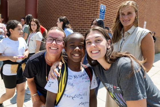 teacher smiling on last day of school with student