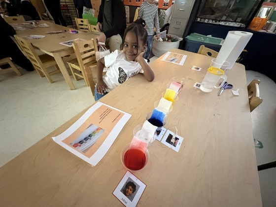 A child with an interactive rainbow strip