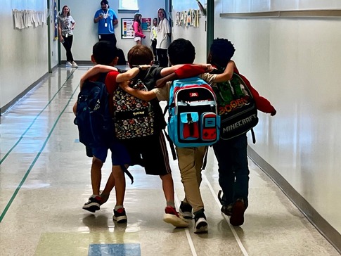 boys walking down hall 
