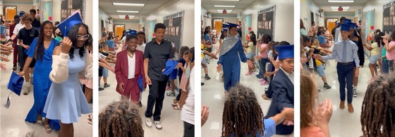 6th grade students dressed up and wearing graduation caps walking through the hall while younger students clap
