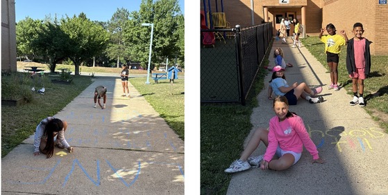 Student Ambassadors drawing designs and messages on the sidewalks near the bus loop and the Kiss and Ride door