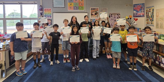 Students exiting the ESOL program with their certificates of achievement