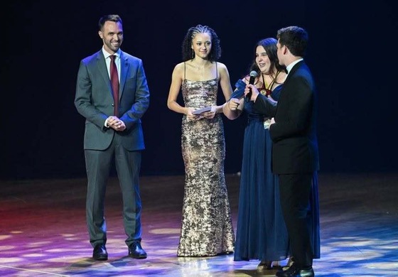 Tom Dannan presenting a cappies award