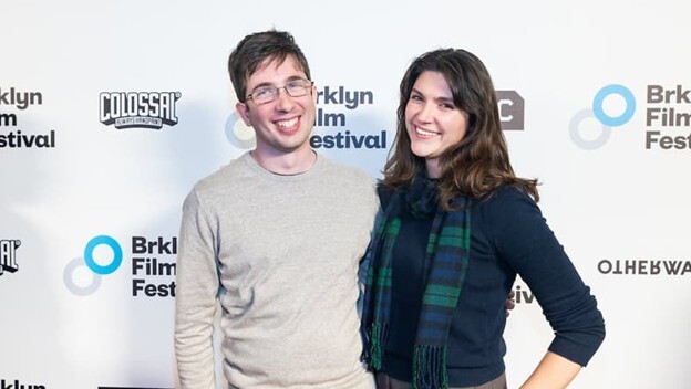 A man and woman posing for a picture