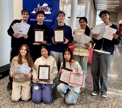 McLean Students showing VHSL activity competition awards in hallway
