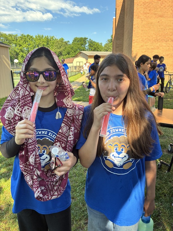 two girls with popsicles