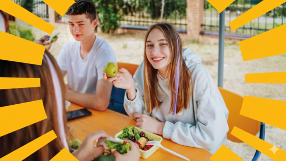 Student holding an apple