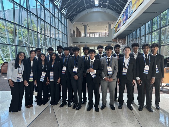 The TJ FBLA team posing as a group inside the conference center.