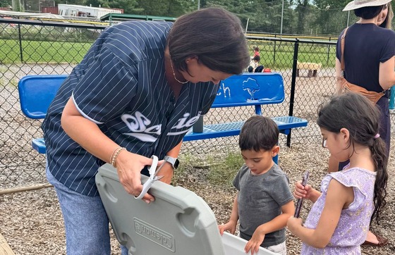 Students receiving popsicles on the playground