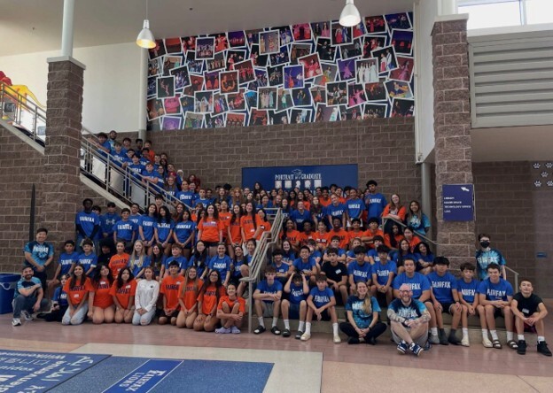 A group of students and teachers posing for a picture