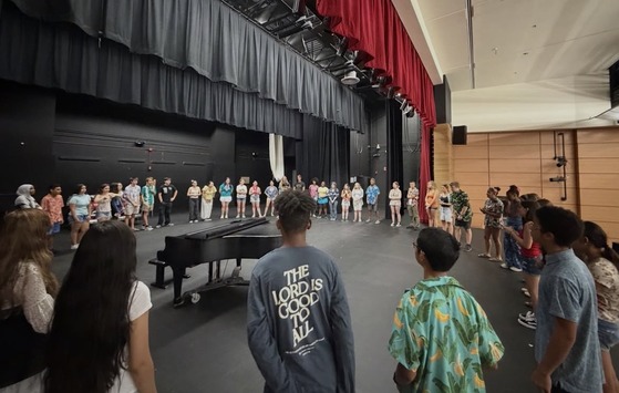 Kids standing on a stage