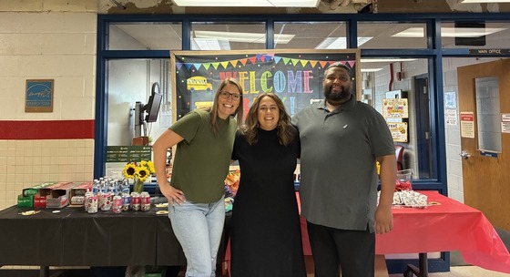 The Leadership Team greets staff working from the building on Friday, August 14.