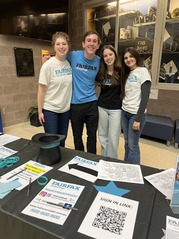 Ambassadors helping at Academy event