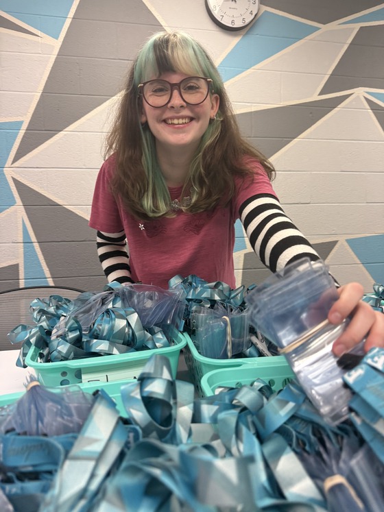 Ambassador prepares lanyards