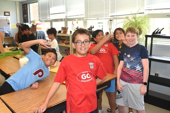 A picture of a group of students excited about returning the school during Open House