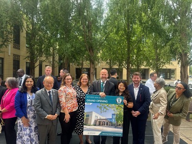 FCPS and community leaders posing together with a Skyview High School Grand Opening sign.