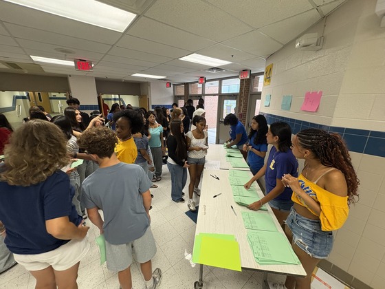 Student picking up their class schedules.