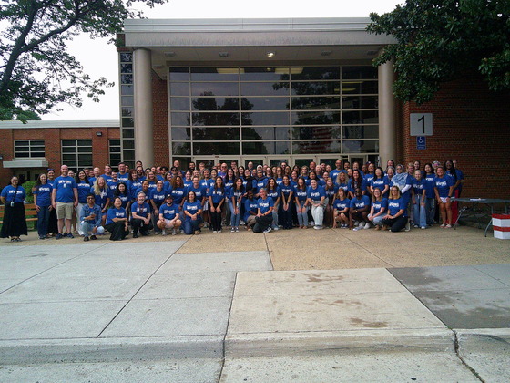 image of Irving MS staff standing in front of school